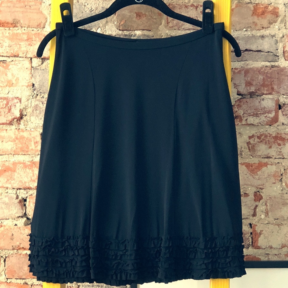 Sisley black skirt with cuff ruffle.